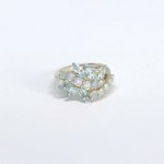 Silver ring with natural opals and topazes