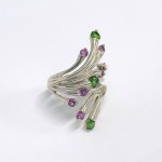 Large silver ring with green and pink garnets