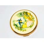 Gold-plated compact with a picture