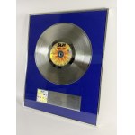 Platinum Record for the band BAJM for selling over 100,000 pieces of the album *PŁOMIEŃ Z NIEBA* - PL1001