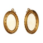 Pair of carved and gilded oval mirrors - France, 19th century
