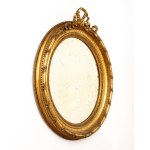 Pair of carved and gilded oval mirrors - France, 19th century
