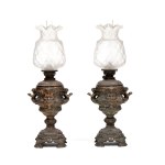 Pair of embossed metal oil lamps - 20th century