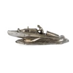 An inkwell shaped like a motorboat