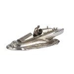 An inkwell shaped like a motorboat