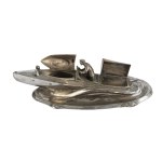An inkwell shaped like a motorboat