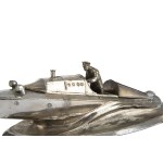 An inkwell shaped like a motorboat