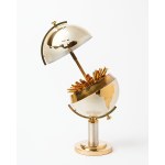 A cigarette case shaped like a globe.