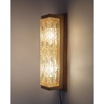 An elongated wall sconce with a shade mounted on a wooden base, Denmark, 1960s.