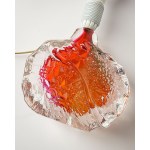 A glass lamp, artistic glass, with a base featuring a beautiful texture and color.