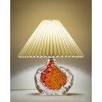 A glass lamp, artistic glass, with a base featuring a beautiful texture and color.