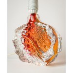A glass lamp, artistic glass, with a base featuring a beautiful texture and color.