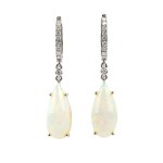 A pair of gold drop earrings with opals and diamonds