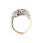 Gold and silver "snake" ring set with Burmese rubies and diamonds.