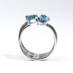 Gold ring with black diamonds and blue topazes