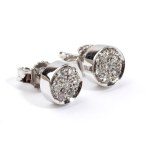 A pair of geometric gold and diamond earrings