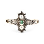 A rigid gold and silver hoop bracelet set with emerald, pearl and diamonds