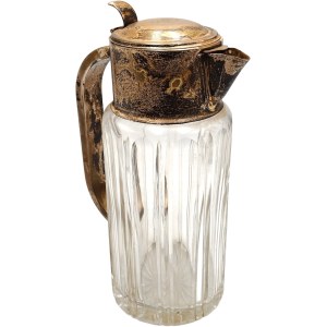 A large, silver-plated beverage jug from the first half of the 20th century—crystal glass, Art Deco period