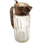 A large, silver-plated beverage jug from the first half of the 20th century—crystal glass, Art Deco period