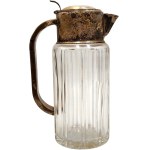 A large, silver-plated beverage jug from the first half of the 20th century—crystal glass, Art Deco period