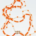 A one-of-a-kind gold necklace made of natural coral and Akoya pearls