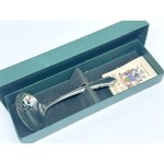 A spoon for serving vegetables, marinades, and other dishes with sauces. Comes with the original box and a certificate