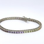 Silver bracelet with natural garnets, peridots, citrines, and amethysts