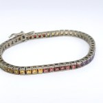 Silver bracelet with natural garnets, peridots, citrines, and amethysts