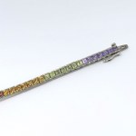 Silver bracelet with natural garnets, peridots, citrines, and amethysts