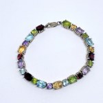 Silver bracelet with natural peridots, citrines, amethysts, topazes, and garnets