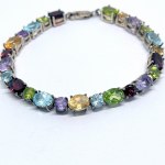 Silver bracelet with natural peridots, citrines, amethysts, topazes, and garnets