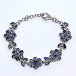Silver floral bracelet with natural tanzanites