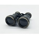 A vintage Le Sportsman binocular with a compass