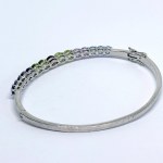 Silver bangle bracelet with natural iolites, amethysts, peridots, and garnets