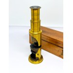 Antique brass field microscope in a case, circa 1910