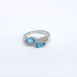 Silver ring with natural white and blue topazes