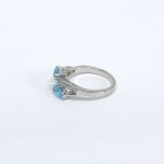 Silver ring with natural white and blue topazes