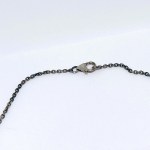 Patinated silver necklace with natural amethysts, moonstones, and quartz