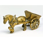 A brass figurine depicting a horse pulling a cart