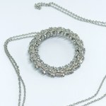 An interesting silver necklace with white topaz