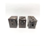 Three Kodak Brownie cameras—the Popular Brownie, the Six-20 Brownie Junior, and the Portrait Brownie