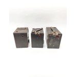 Three Kodak Brownie cameras—the Popular Brownie, the Six-20 Brownie Junior, and the Portrait Brownie
