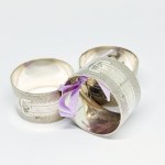 Three silver-plated napkin holders