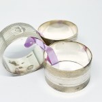 Three silver-plated napkin holders