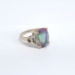 Silver ring with a large mystic topaz