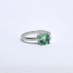 Silver ring with a natural green sapphire