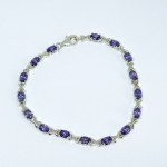 Silver bracelet with purple stones