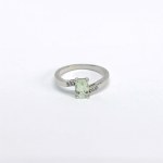 Silver ring with a natural prasiolite and white topazes