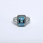 Silver ring with a large natural topaz and white topazes