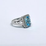 Silver ring with a large natural topaz and white topazes